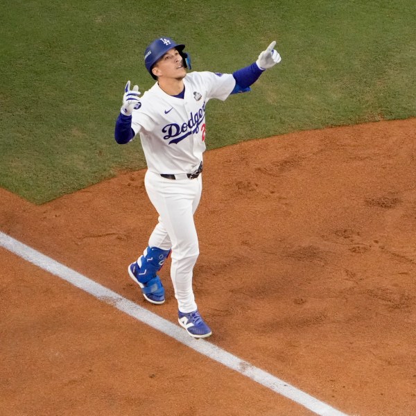 FILE - Los Angeles Dodgers' Tommy Edman celebrates as he reaches home plate after his solo home run during the second inning in Game 2 of the baseball World Series against the New York Yankees, Oct. 26, 2024, in Los Angeles. (AP Photo/Mark J. Terrill, File)