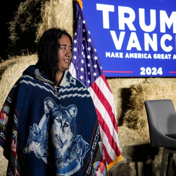 FILE - Abigail Blue, a member of the Lumbee Tribe, walks by the stage during a campaign event in support of Republican presidential nominee former President Donald Trump, Oct. 18, 2024, in Red Springs, N.C. (AP Photo/David Yeazell, File)