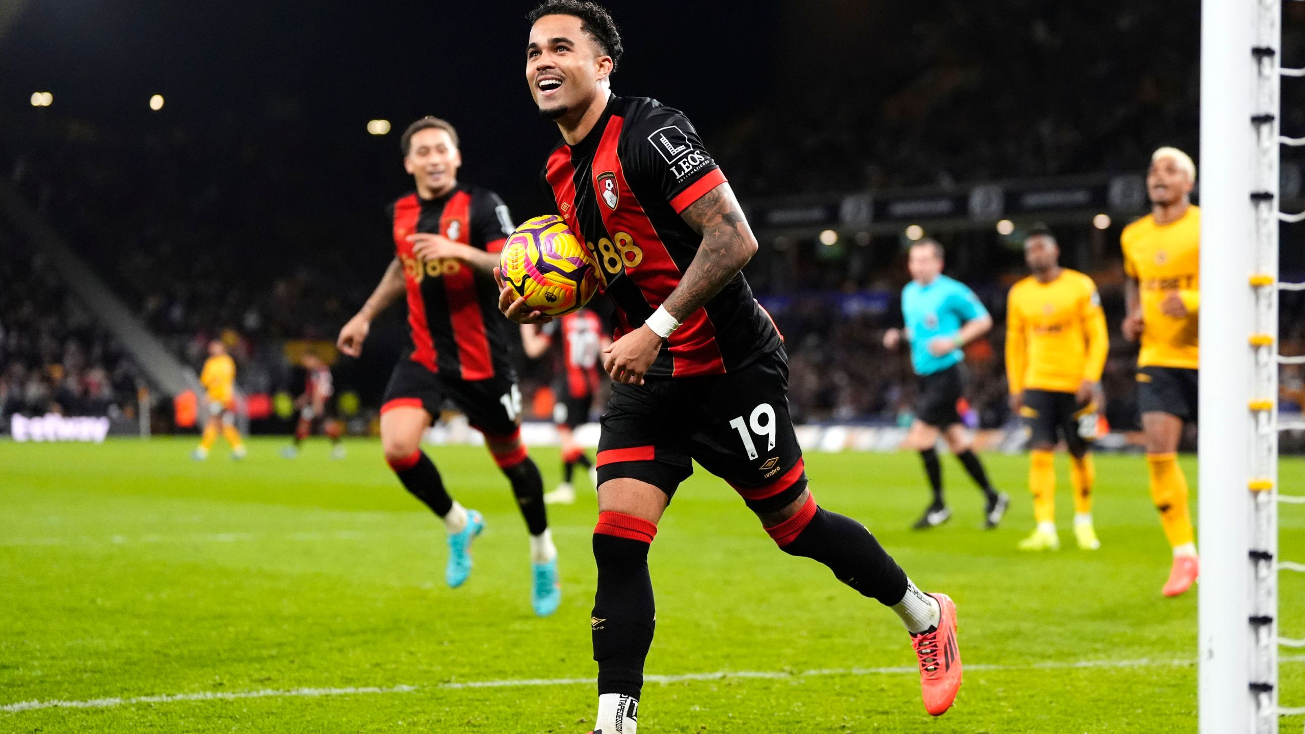 Bournemouth's Justin Kluivert celebrates scoring during the English Premier League soccer match at Molineux Stadium, Wolverhampton, England, Saturday Nov. 30, 2024. (Nick Potts/PA via AP)