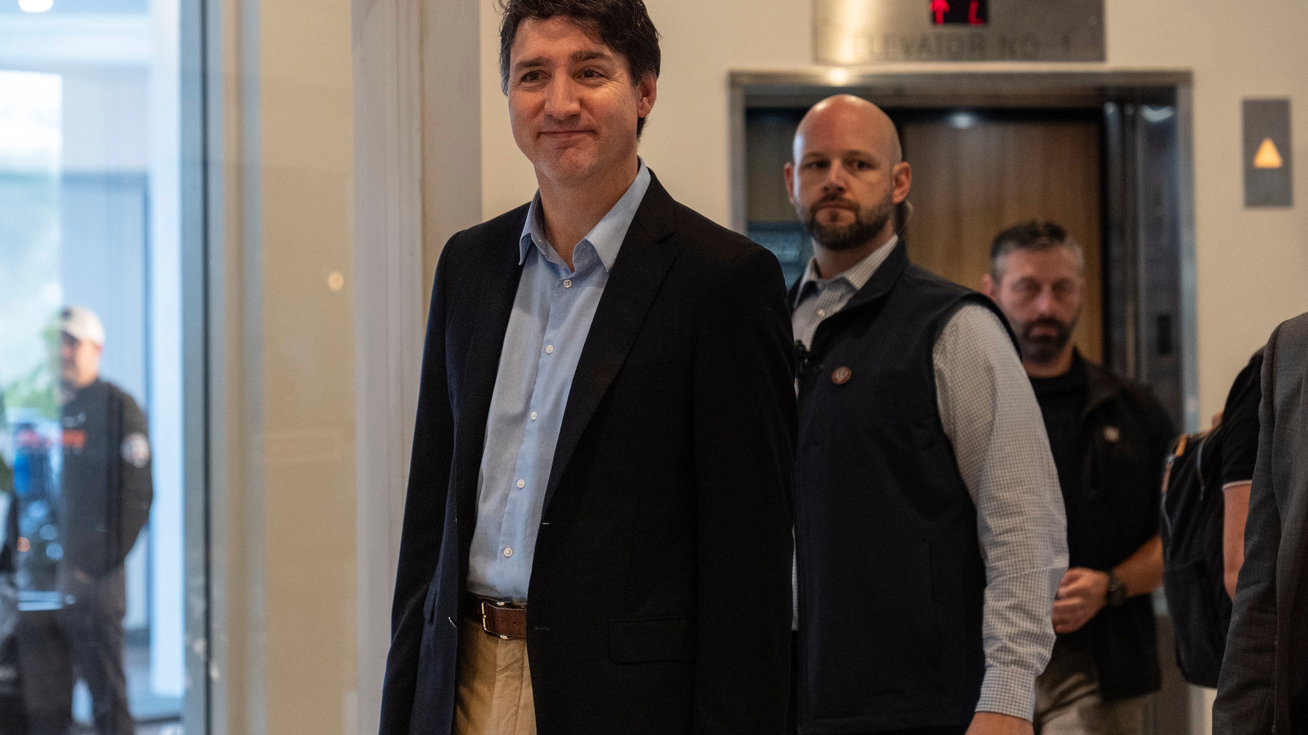 Canada Prime Minister Justin Trudeau walks through the lobby of the Delta Hotel by Marriott, Saturday, Nov. 30, 2024, in West Palm Beach, Fla. (AP Photo/Carolyn Kaster)