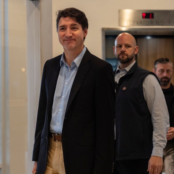 Canada Prime Minister Justin Trudeau walks through the lobby of the Delta Hotel by Marriott, Saturday, Nov. 30, 2024, in West Palm Beach, Fla. (AP Photo/Carolyn Kaster)