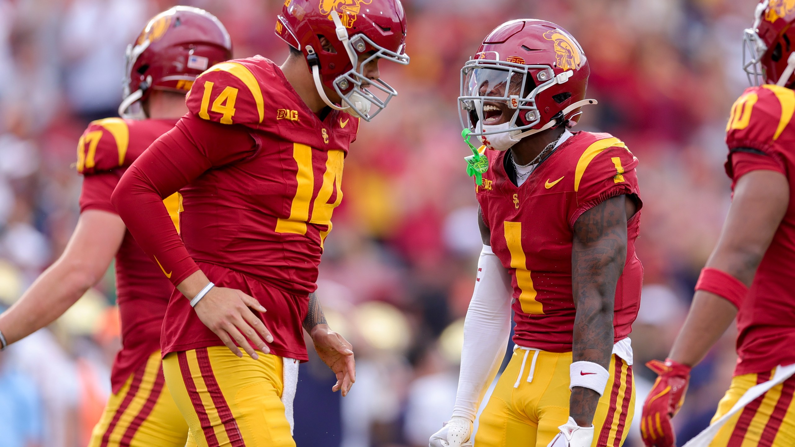 Southern California wide receiver Zachariah Branch (1) celebrates with quarterback Jayden Maiava (14) after his touchdown during the first half of an NCAA football game against Notre Dame, Saturday, Nov. 30, 2024, in Los Angeles. (AP Photo/Ryan Sun)