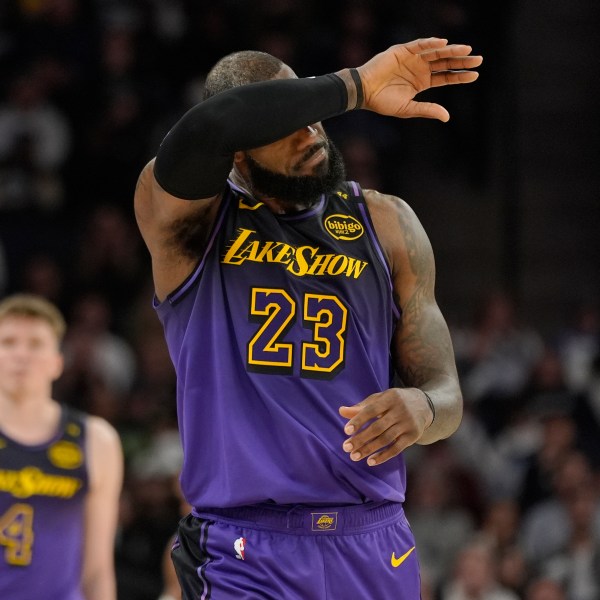 Los Angeles Lakers forward LeBron James (23) walks downcourt during the second half of an NBA basketball game against the Minnesota Timberwolves, Monday, Dec. 2, 2024, in Minneapolis. (AP Photo/Abbie Parr)