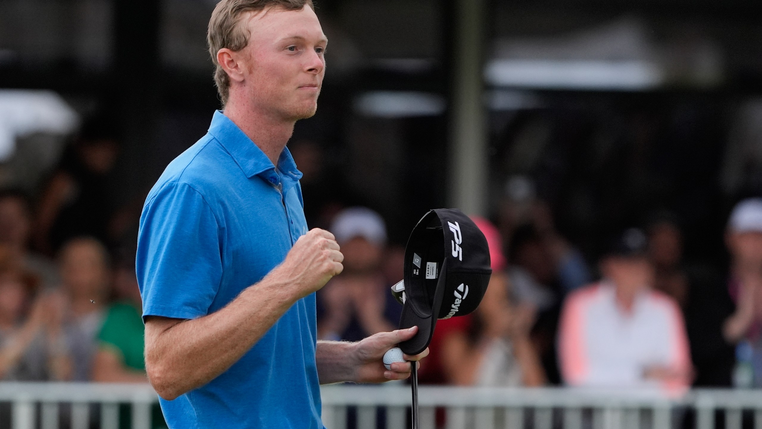 Ryggs Johnston of the United States reacts after winning the Australian Open golf championship at the Kingston Heath Golf Club in Melbourne, Australia, Sunday, Dec. 1, 2024. (AP Photo/Asanka Brendon Ratnayake)