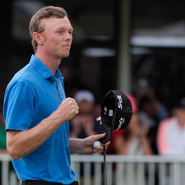 Ryggs Johnston of the United States reacts after winning the Australian Open golf championship at the Kingston Heath Golf Club in Melbourne, Australia, Sunday, Dec. 1, 2024. (AP Photo/Asanka Brendon Ratnayake)