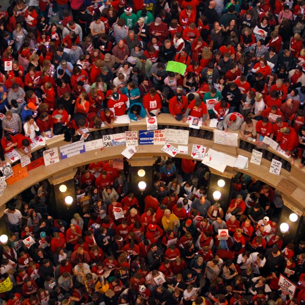 FILE - This file photo taken Feb. 17, 2011 shows protestors of Wisconsin Gov. Scott Walker's bill to eliminate collective bargaining rights for many state workers packing the rotunda at the State Capitol in Madison, Wis. (AP Photo/Andy Manis, File)