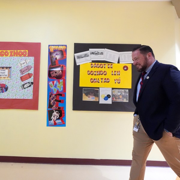 Rice Intermediate School Principal Nicholas Ferro walks to a classroom at Rice Intermediate School Tuesday, Aug. 27, 2024, in San Carlos, Ariz. (AP Photo/Ross D. Franklin)