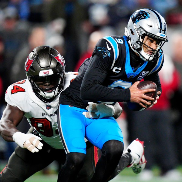 Carolina Panthers quarterback Bryce Young is sacked by Tampa Bay Buccaneers defensive tackle Calijah Kancey during the second half of an NFL football game, Sunday, Dec. 1, 2024, in Charlotte, N.C. (AP Photo/Jacob Kupferman)