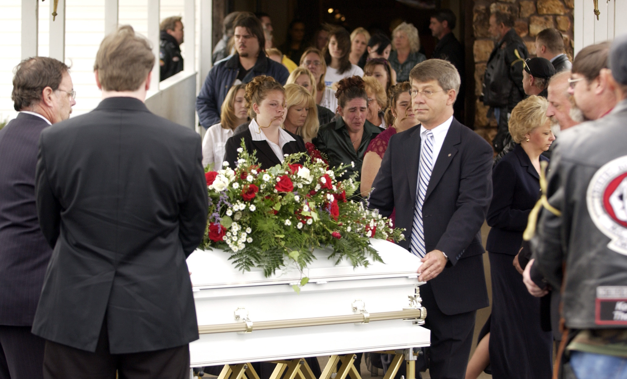 FILE - Pallbearers and employees of Clark Funeral Home get ready to put Rowan Ford's casket into a hearst after the funeral at the Gospel Lighthouse Church in Neosho, Mo., Nov. 14, 2007. (AP Photo/Mike Gullett, File)