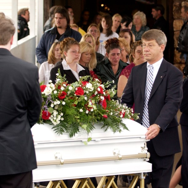 FILE - Pallbearers and employees of Clark Funeral Home get ready to put Rowan Ford's casket into a hearst after the funeral at the Gospel Lighthouse Church in Neosho, Mo., Nov. 14, 2007. (AP Photo/Mike Gullett, File)