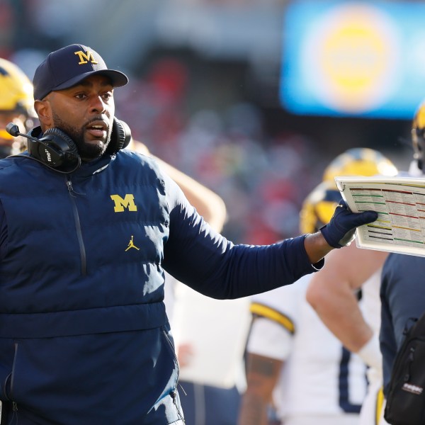 Michigan head coach head coach Sherrone Moore talks to his team during the second half of an NCAA college football game against Michigan Saturday, Nov. 30, 2024, in Columbus, Ohio. (AP Photo/Jay LaPrete)