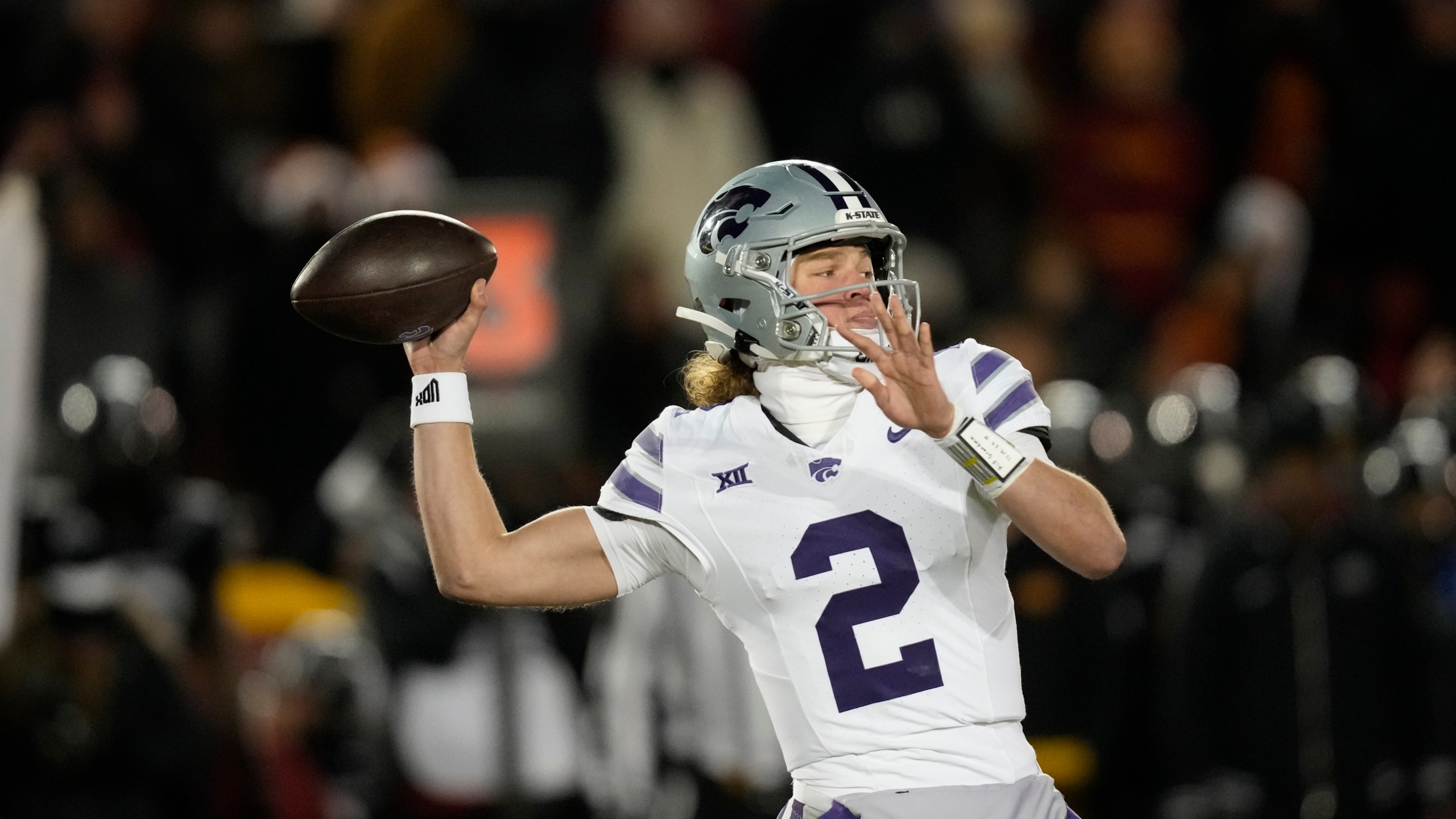 Kansas State quarterback Avery Johnson throws a pass during the first half of an NCAA college football game against Iowa State, Saturday, Nov. 30, 2024, in Ames, Iowa. (AP Photo/Charlie Neibergall)