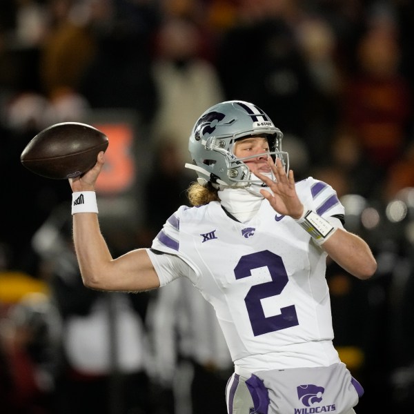 Kansas State quarterback Avery Johnson throws a pass during the first half of an NCAA college football game against Iowa State, Saturday, Nov. 30, 2024, in Ames, Iowa. (AP Photo/Charlie Neibergall)