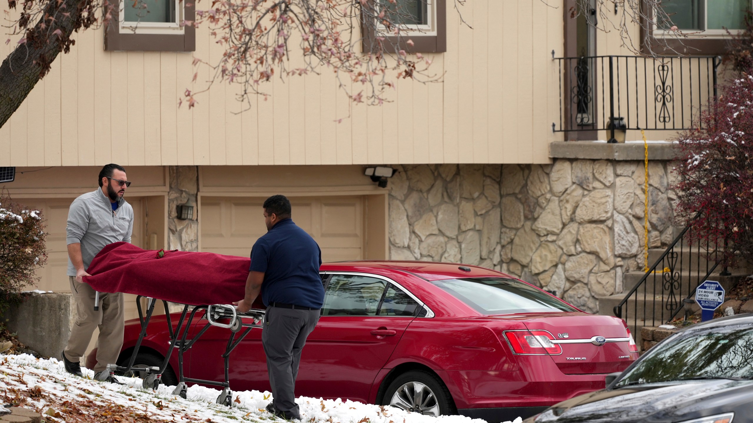 Workers carry a body from the home of former Kansas City, Kan. police detective Roger Golubski on Monday, Dec. 2, 2024, in Edwardsville, Kan. (AP Photo/Charlie Riedel)