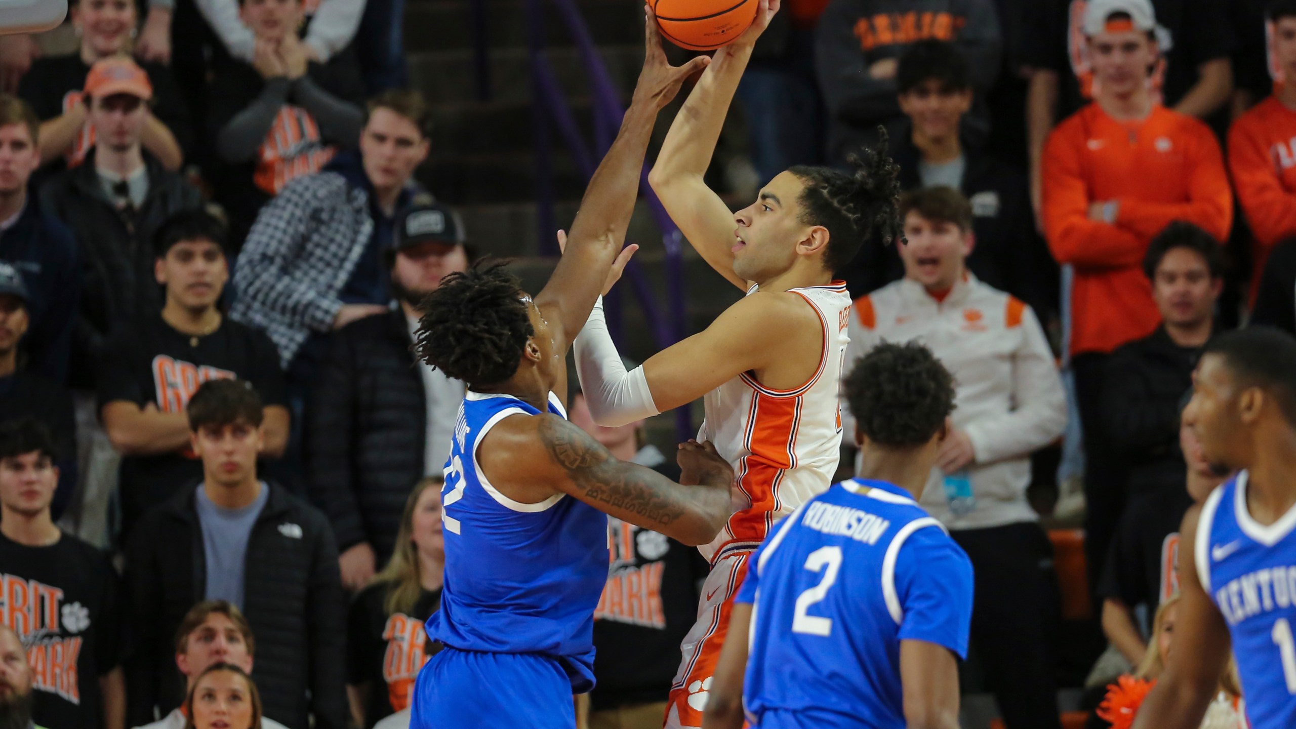 Kentucky center Amari Williams, left, blocks the shot attempt by Clemson center Christian Reeves, right, during the first half of an NCAA college basketball game, Tuesday, Dec. 3, 2024, in Clemson, S.C. (AP Photo/Artie Walker Jr.)