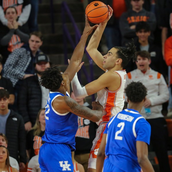 Kentucky center Amari Williams, left, blocks the shot attempt by Clemson center Christian Reeves, right, during the first half of an NCAA college basketball game, Tuesday, Dec. 3, 2024, in Clemson, S.C. (AP Photo/Artie Walker Jr.)