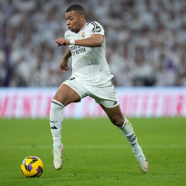 Real Madrid's Kylian Mbappe takes control of the ball during the Spanish La Liga soccer match between Real Madrid and Getafe at the Santiago Bernabeu Stadium in Madrid, Spain, Sunday, Dec. 1, 2024. (AP Photo/Bernat Armangue)