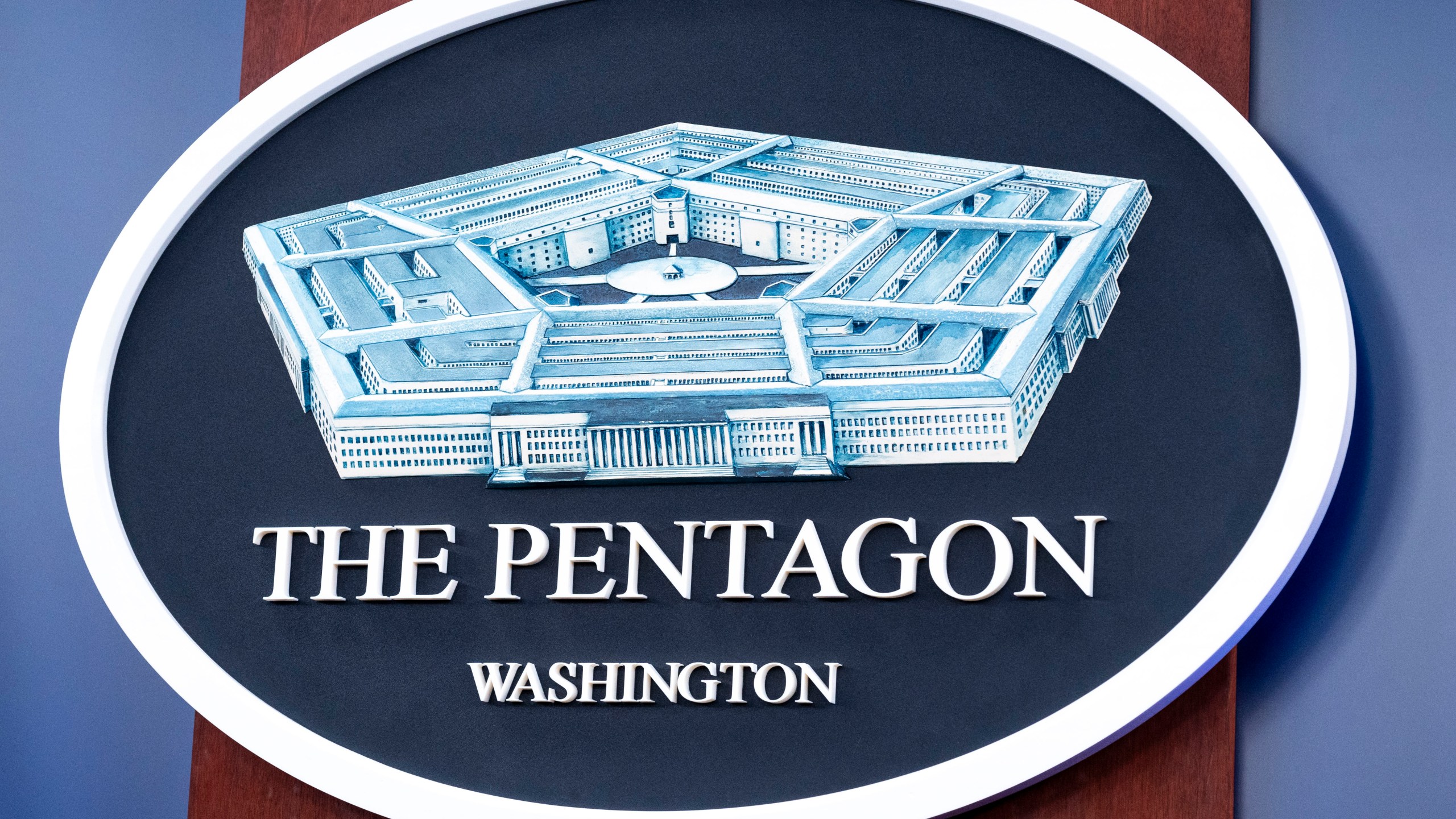 The Department of Defense logo is seen on the wall in the Press Briefing room at the Pentagon on Tuesday, Oct. 29, 2024 in Washington. (AP Photo/Kevin Wolf)