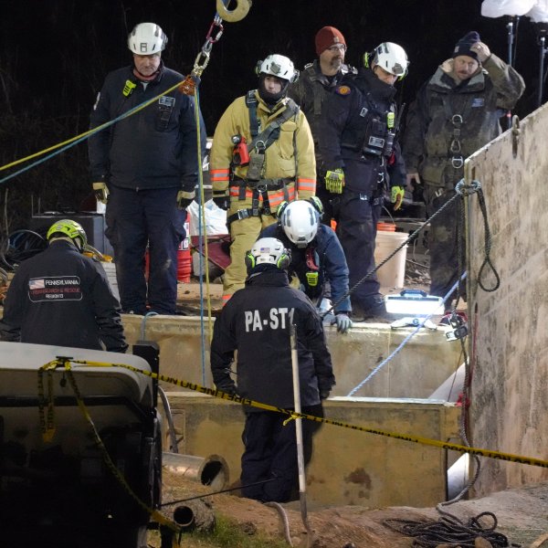 Rescue workers search through the night in a sinkhole for Elizabeth Pollard, who disappeared while looking for her cat, in Marguerite, Pa., Tuesday, Dec. 3, 2024. (AP Photo/Gene J. Puskar)