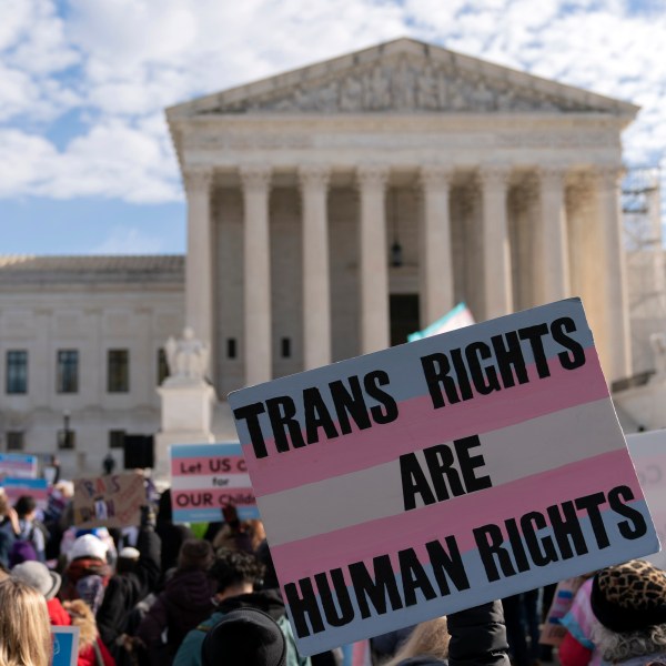 Transgenders rights supporters rally outside of the Supreme Court, Wednesday, Dec. 4, 2024, in Washington. (AP Photo/Jose Luis Magana)