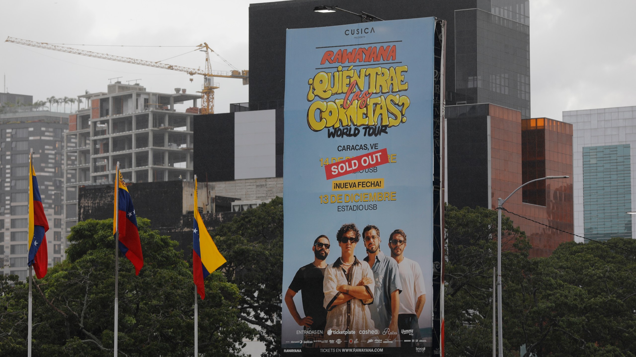 A billboard advertising concerts of Venezuelan band Rawayana stands on a main highway in Caracas, Venezuela, Wednesday, Dec 4, 2024. (AP Photo/Cristian Hernandez)