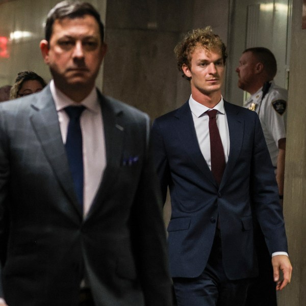 Daniel Penny, right, walks out of the courtroom, next to Thomas Kenniff, left, his lawyer, Wednesday, Dec. 4, 2024, in New York. (AP Photo/Heather Khalifa)