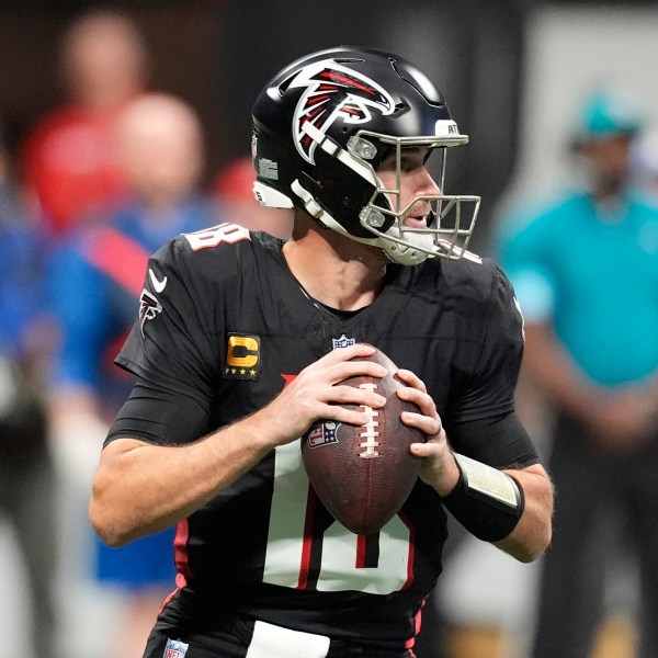 Atlanta Falcons quarterback Kirk Cousins (18) looks to pass during the first half of an NFL football game against the Los Angeles Chargers on Sunday, Dec. 1, 2024 in Atlanta.(AP Photo/Mike Stewart)