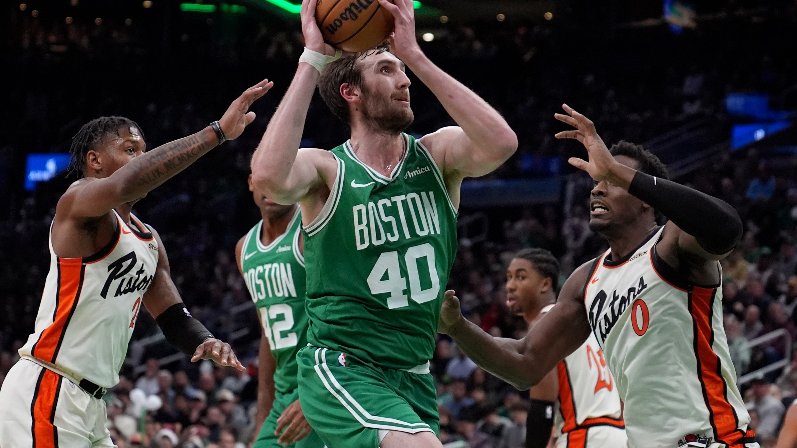 Boston Celtics center Luke Kornet (40) drives to the basket against the Detroit Pistons during the first half of an NBA basketball game, Wednesday, Dec. 4, 2024, in Boston. (AP Photo/Charles Krupa)