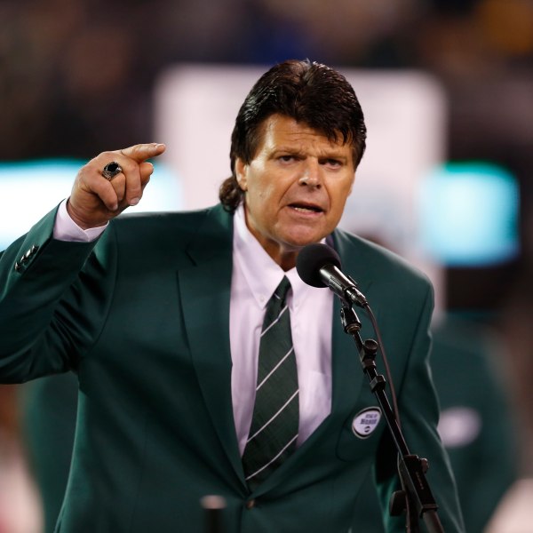 FILE - Former New York Jets defensive end Mark Gastineau gestures during the half time show of an NFL football game between the New York Jets and the Houston Texans Monday, Oct. 8, 2012, in East Rutherford, N.J. (AP Photo/Julio Cortez, File)