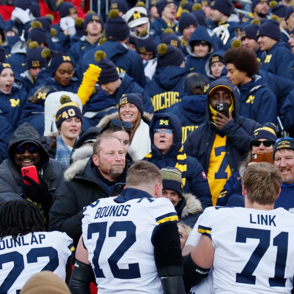 Michigan players celebrate their win over Ohio State in an NCAA college football game Saturday, Nov. 30, 2024, in Columbus, Ohio. (AP Photo/Jay LaPrete)