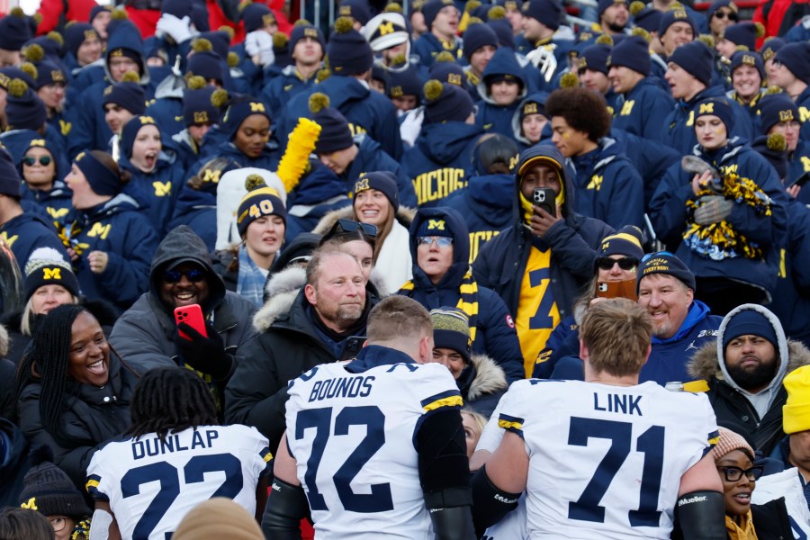 Michigan players celebrate their win over Ohio State in an NCAA college football game Saturday, Nov. 30, 2024, in Columbus, Ohio. (AP Photo/Jay LaPrete)