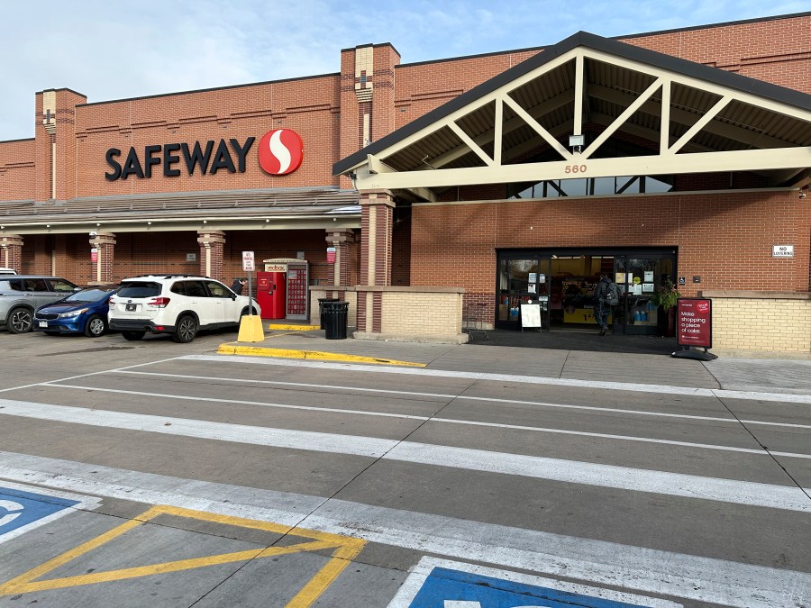 A shopper heads into a Safeway store, which is part of the Albertson's grocery chain, Tuesday, Dec. 10, 2024, in Denver. (AP Photo/David Zalubowski)