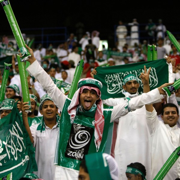 FILE - Saudi Arabian fans celebrate during a World Cup Asian qualifying playoff soccer match between Saudi Arabia and Bahrain at King Fahd Stadium in Riyadh, Saudi Arabia, Wednesday, Sept. 9, 2009. (AP Photo/Hassan Ammar, File)