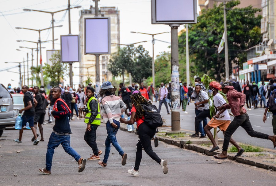 FILE - Protesters disperse as police deploy in Maputo, Mozambique, Thursday, Nov. 7, 2024. Protesters dispute the outcome of the Oct. 9 elections, which saw the ruling Frelimo party extend its 49-year rule. (AP Photo/Carlos Uqueio, File)