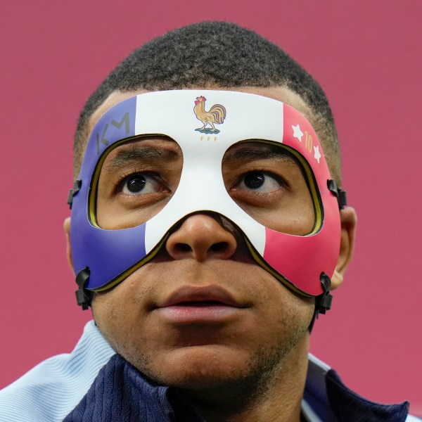 FILE - France's Kylian Mbappe looks up as he wears a face mask during a team training session in Leipzig, Germany, Thursday, June 20, 2024. (AP Photo/Hassan Ammar, file)