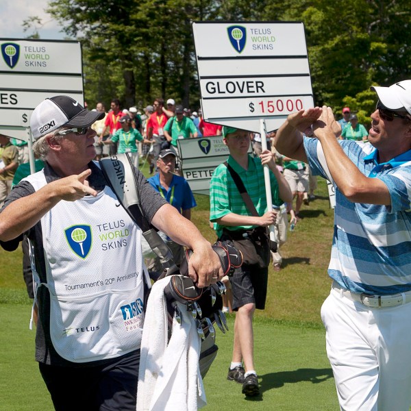 FILE - Canada's Steve Ames, right, and his caddie, Adrian Watey, chat during the Telus World Skins game at Glen Arbour golf course in Halifax, Nova Scotia, on Tuesday, July 31, 2012. (Andrew Vaughan/The Canadian Press via AP, File)