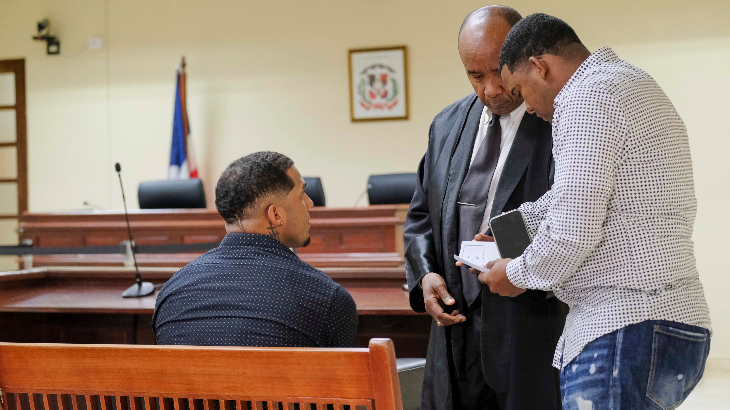 Tampa Bay Rays shortstop Wander Franco, left, attends his trial on charges of sexually abusing a minor, sexual and commercial exploitation against a minor and human trafficking, accompanied by his lawyer Teodosio Jaquez, center, in Puerto Plata, Dominican Republic, Thursday, Dec. 12, 2024. (AP Photo/Ricardo Hernandez)