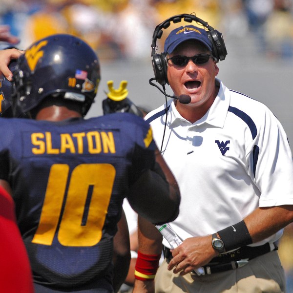 FILE - West Virginia coach Rich Rodriguez yells onto the field during the second half of a college football game against East Carolina in this Sept. 22, 2007 file photo, in Morgantown, W.Va. (AP Photo/Jeff Gentner, File)