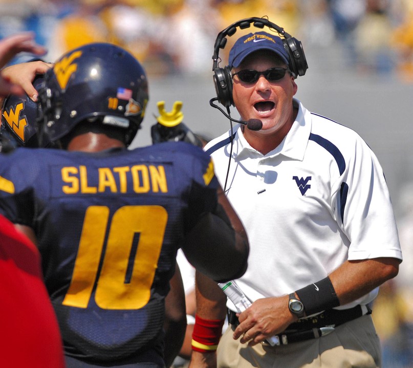 FILE - West Virginia coach Rich Rodriguez yells onto the field during the second half of a college football game against East Carolina in this Sept. 22, 2007 file photo, in Morgantown, W.Va. (AP Photo/Jeff Gentner, File)