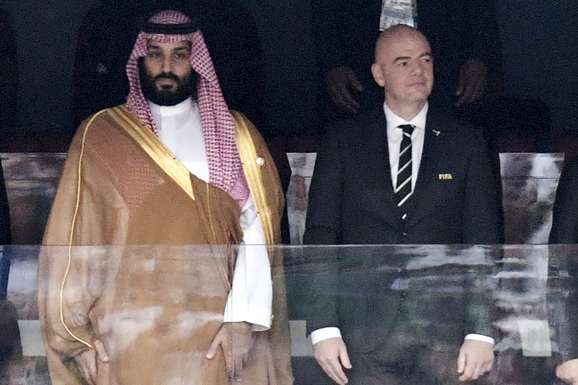 FILE - Saudi Arabia Crown Prince Mohammed bin Salman, left, and FIFA President Gianni Infantino, stand for the anthem prior to opening soccer match of the 2018 World Cup between Russia and Saudi Arabia at the Luzhniki stadium in Moscow, Russia, on June 14, 2018. (Alexei Nikolsky/Sputnik, Kremlin Pool Photo via AP, File)