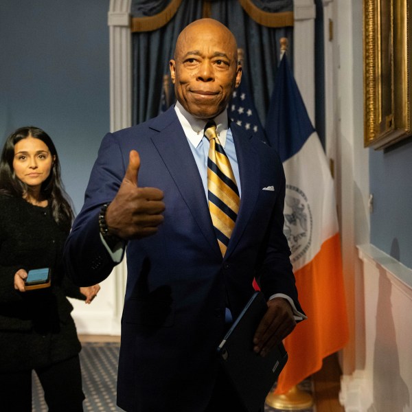 New York City Mayor Eric Adams gestures as he leaves a press conference at City Hall following meeting with President-elect Donald Trump’s incoming "border czar" Tom Homan, Thursday, Dec. 12, 2024, in New York. (AP Photo/Yuki Iwamura)