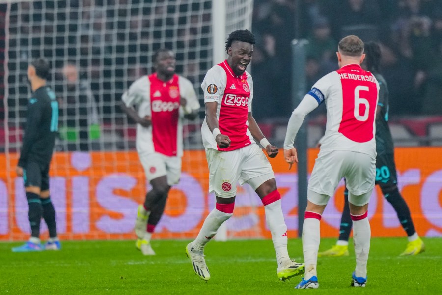 Ajax's Bertrand Traore, centre, celebrates after scoring during the Europa League soccer match between Ajax and Lazio Roma at the Johan Cruyff Arena in Amsterdam, Netherlands, Thursday, Dec. 12, 2024. (AP Photo/Peter Dejong)