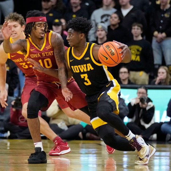 Iowa guard Drew Thelwell (3) drives past Iowa State guard Keshon Gilbert (10) during the first half of an NCAA college basketball game, Thursday, Dec. 12, 2024, in Iowa City, Iowa. (AP Photo/Charlie Neibergall)