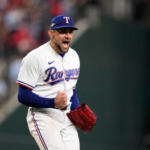 FILE - In this Oct. 10, 2023, photo, Texas Rangers starting pitcher Nathan Eovaldi celebrates on the mound after getting an out against the Baltimore Orioles in Game 3 of an American League Division Series baseball game in Arlington, Texas. (AP Photo/Tony Gutierrez, file)