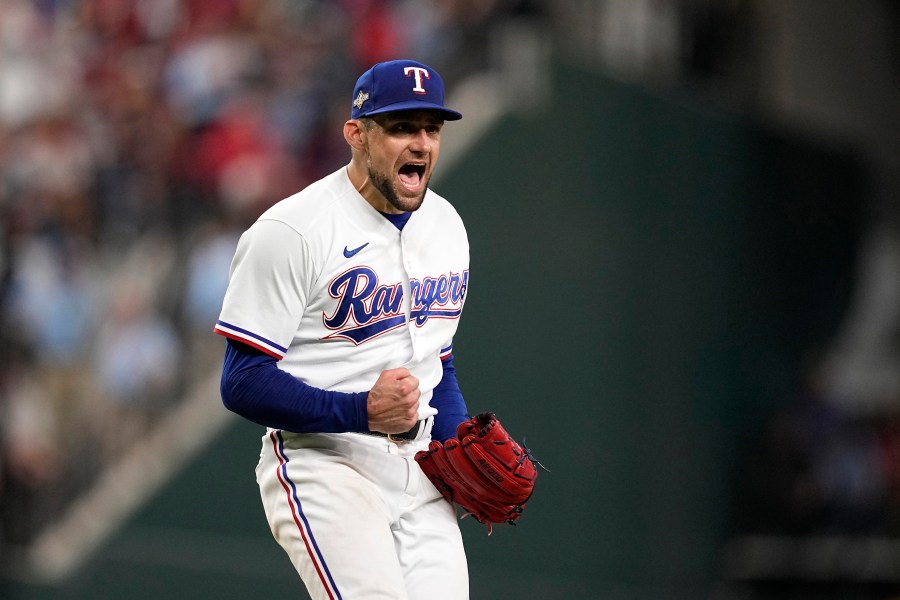 FILE - In this Oct. 10, 2023, photo, Texas Rangers starting pitcher Nathan Eovaldi celebrates on the mound after getting an out against the Baltimore Orioles in Game 3 of an American League Division Series baseball game in Arlington, Texas. (AP Photo/Tony Gutierrez, file)