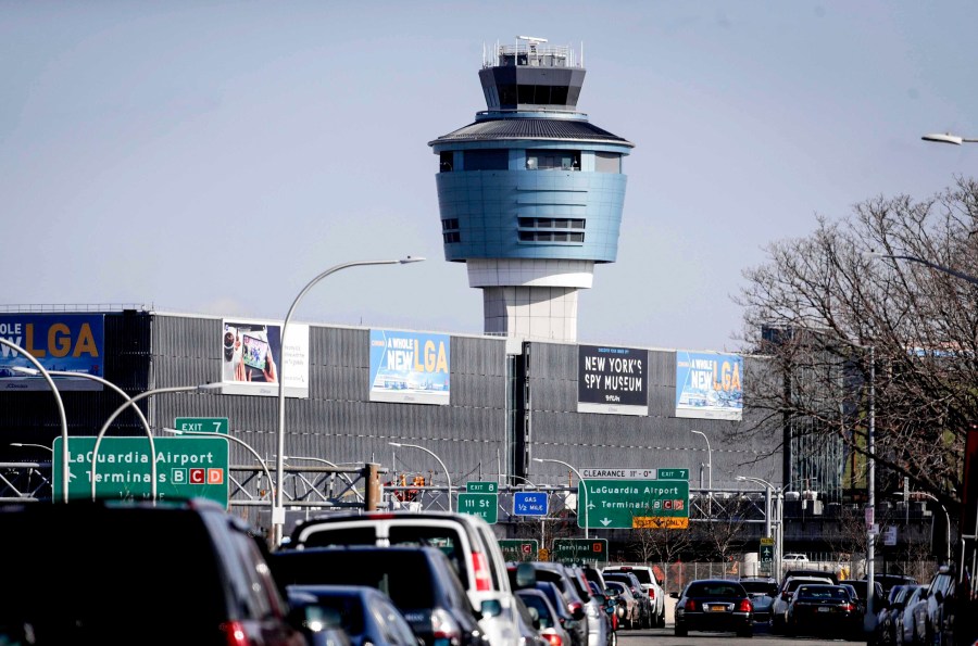 FILE - In this Friday Jan. 25, 2019, file photo is the air traffic control tower at LaGuardia Airport in New York. (AP Photo/Julio Cortez, File)