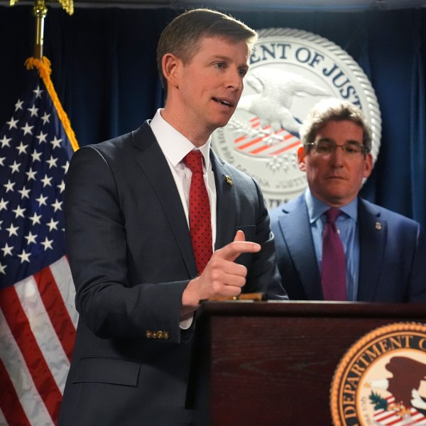 Christopher R. Kavanaugh, the United States Attorney for the Western District of Virginia, gestures while announcing that the McKinsey & Company agreed to pay $650 million for helping Purdue Pharma boost opioid sales during a news conference at the Moakley Federal Courthouse, Friday, Dec. 13, 2024, in Boston. At right is Joshua S. Levy, the United States Attorney for the District of Massachusetts. (AP Photo/Charles Krupa)