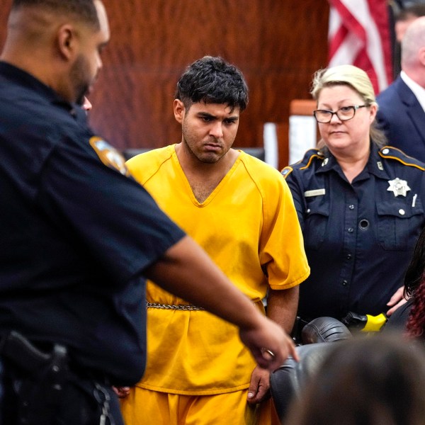 FILE - Johan Jose Martinez-Rangel, one of the two men accused of killing 12-year-old Jocelyn Nungaray, is led from the courtroom by deputies on Tuesday, June 25, 2024 in Houston. (Brett Coomer/Houston Chronicle via AP, File)