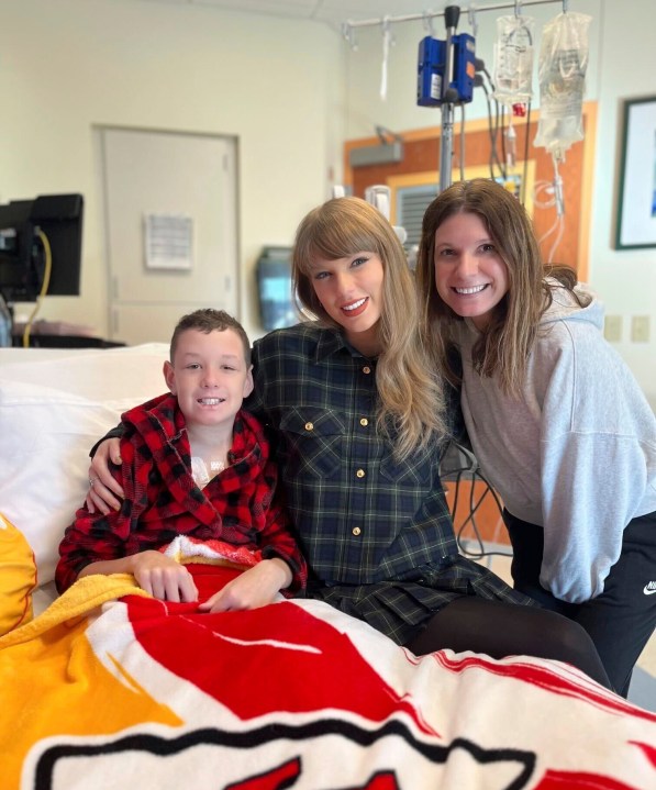 In this image provided by Cassie Thomas, Beckett Thomas, 13, who is a patient at Children's Mercy Hospital in Kansas City, Mo., and his mother Cassie Thomas, right, pose with Taylor Swift, Thursday, Dec. 12, 2024. (Cassie Thomas via AP)