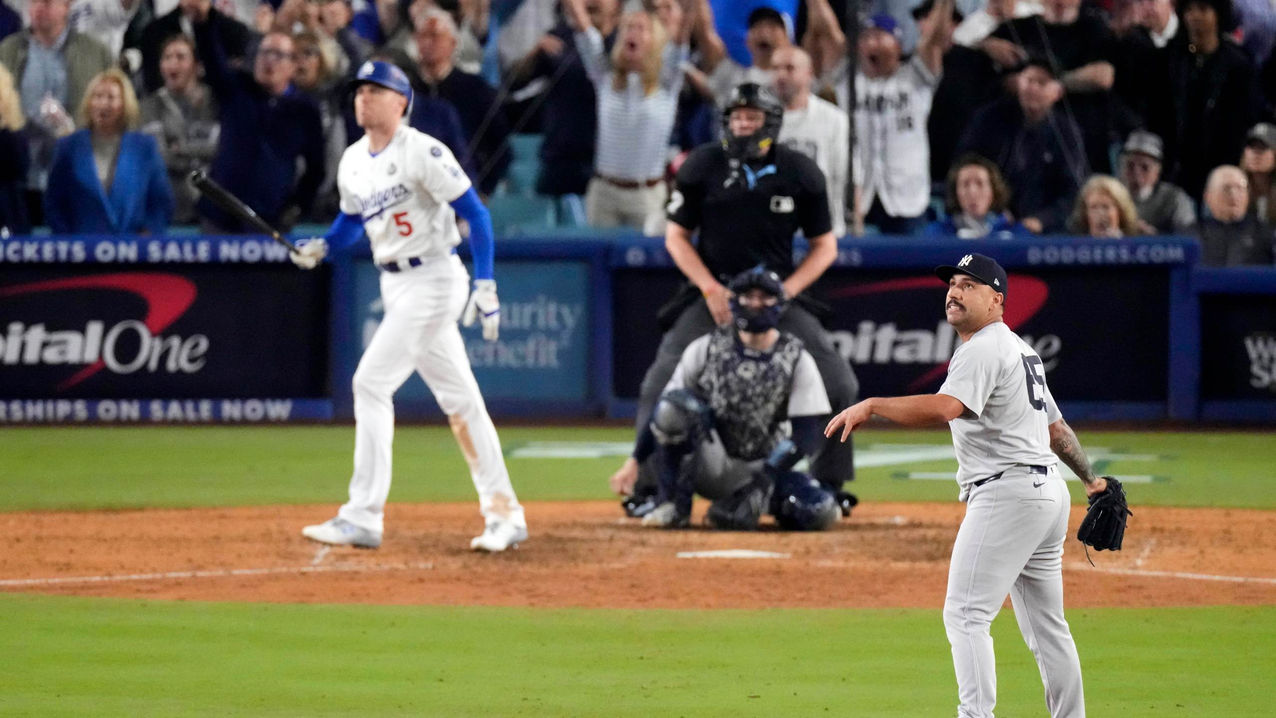 FILE - New York Yankees relief pitcher Nestor Cortes, right, watches as Los Angeles Dodgers' Freddie Freeman, left, hits a walk-off grand slam home run during the 10th inning in Game 1 of the baseball World Series, Friday, Oct. 25, 2024, in Los Angeles. (AP Photo/Mark J. Terrill, File)